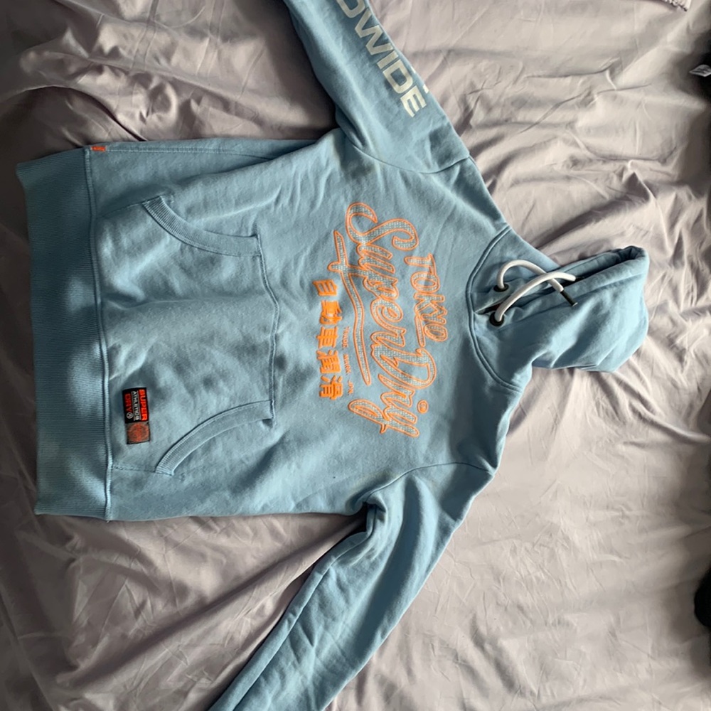Super dry hoodie does not fit my husband anymore .